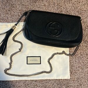 Gucci crossbody bag. Black with silvered chain. Only used a handful of times.